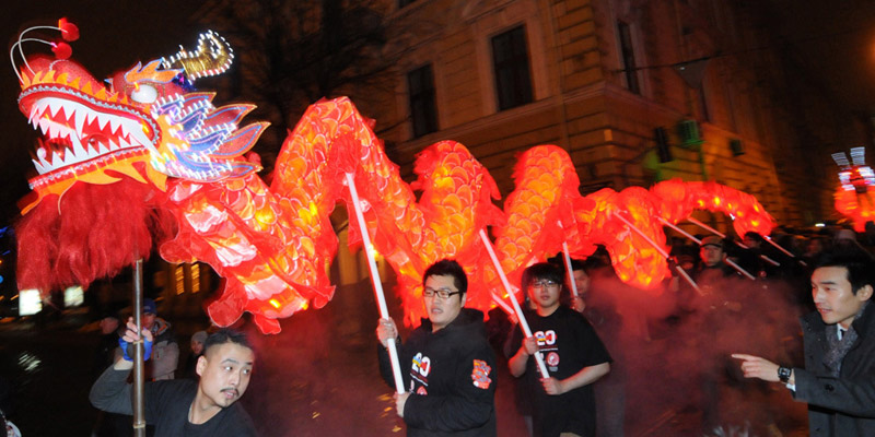 Chinese living in Ukraine carry a dragon on January 22